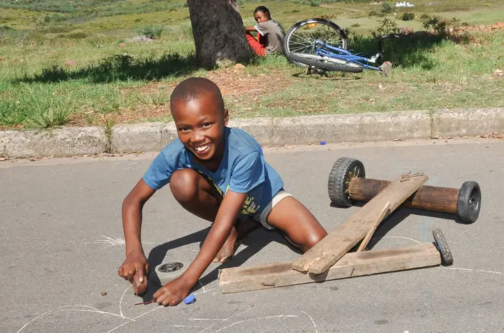 Elrick Ricky, 8, straightens a nail for his go-cart. Railton, Swellendam 2019