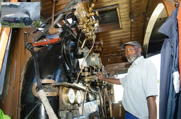 Michael Dyanti posing in the cab of steam train Jessica. 2017